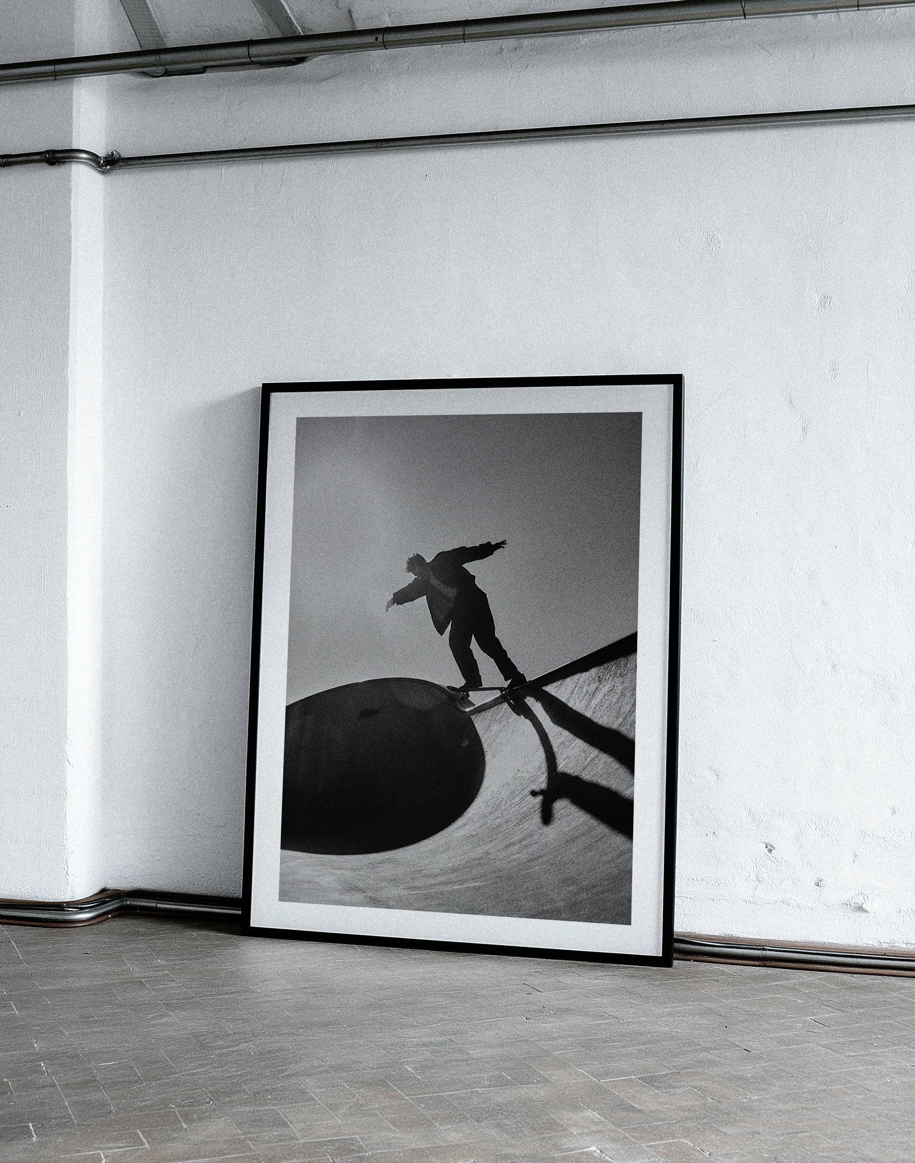 Modern living room with a framed black and white photography print.