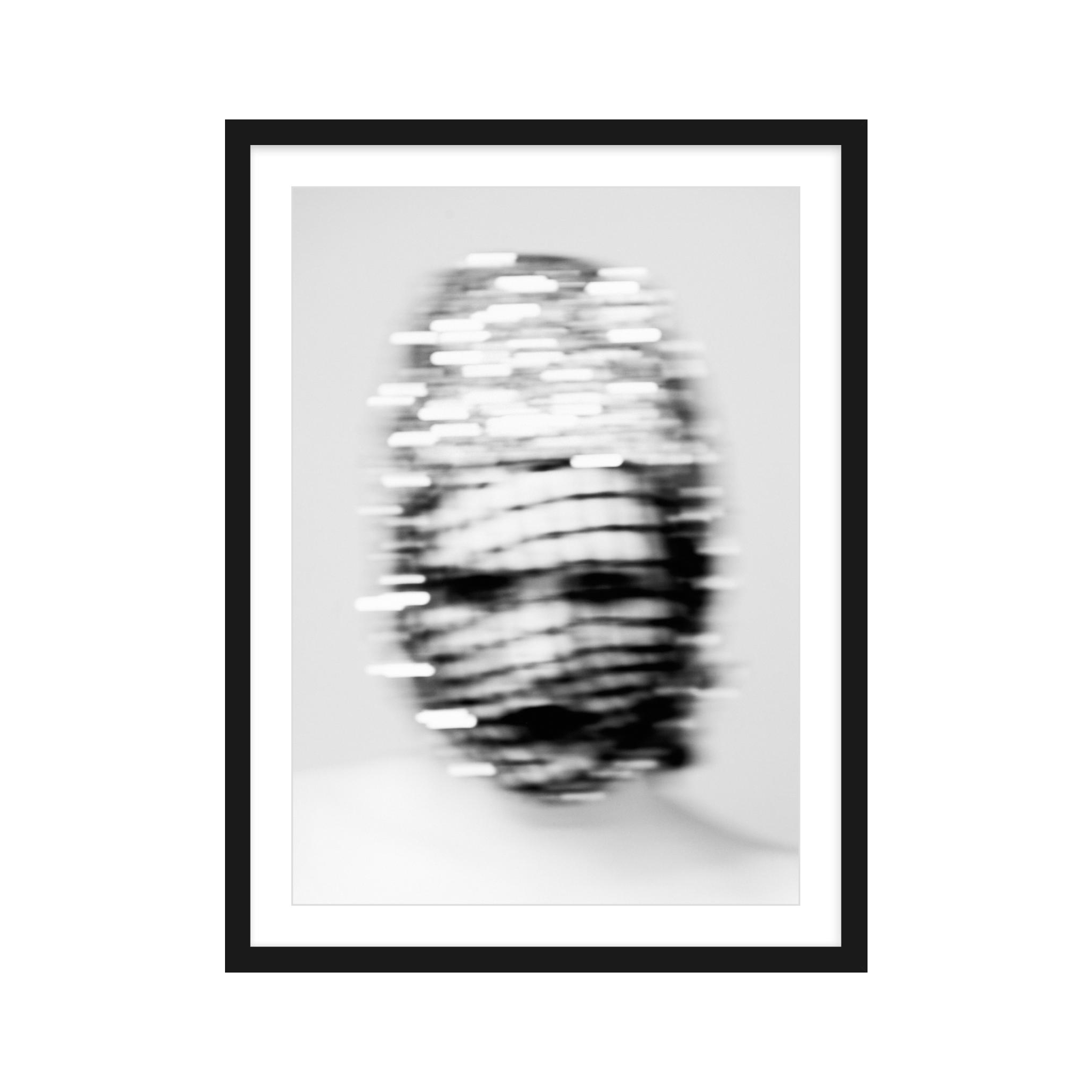 Framed black and white abstract art print on a white background