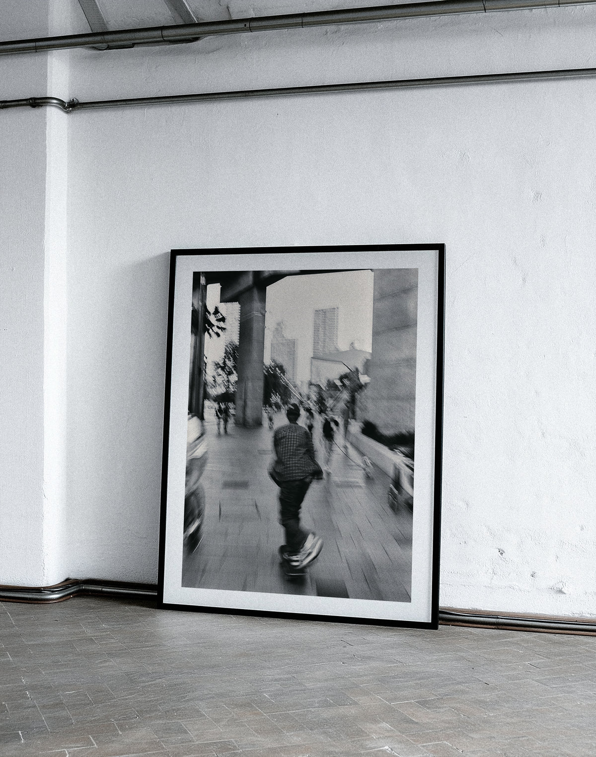 Framed black and white photograph on a white wall
