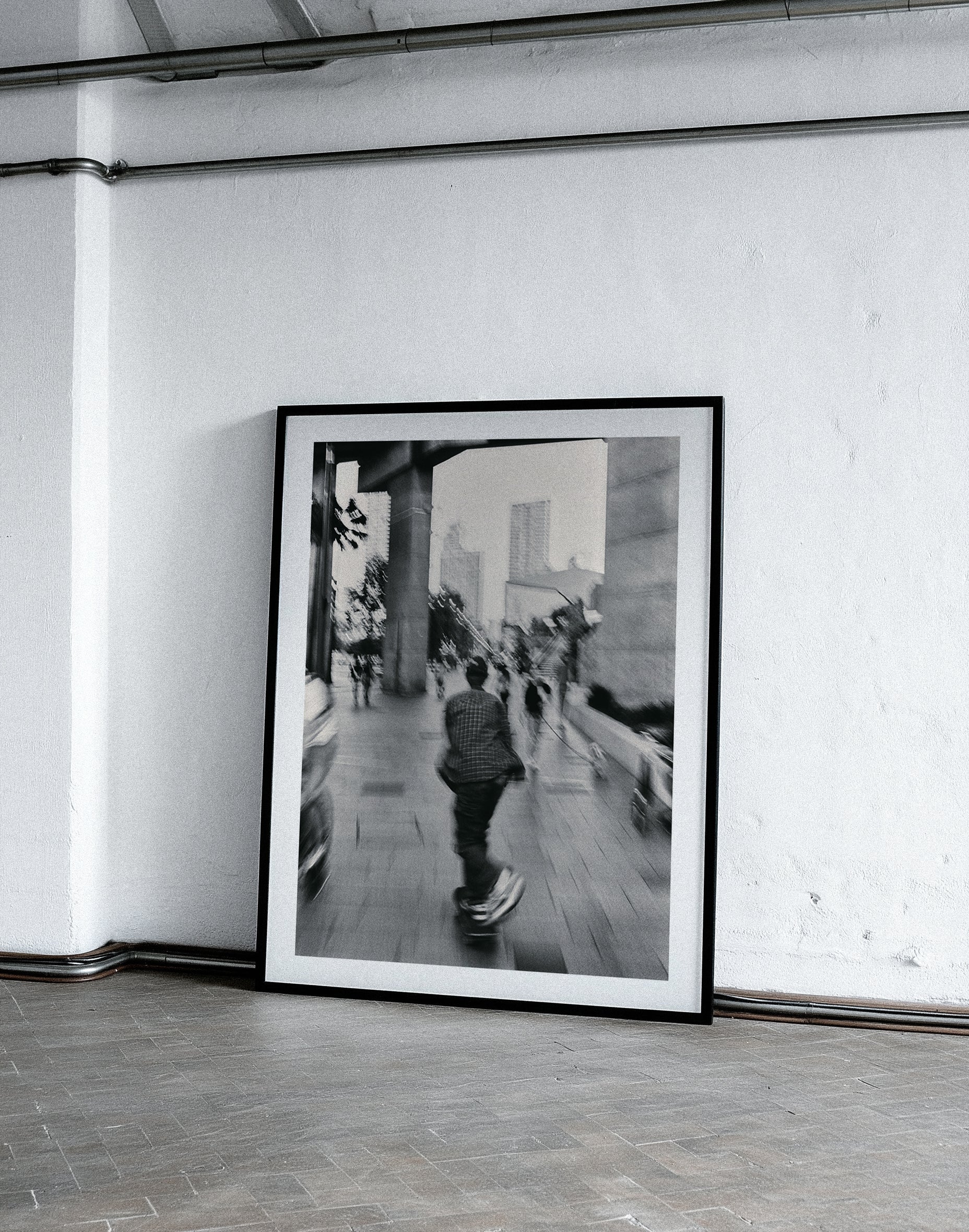 Framed black and white photograph on a white wall