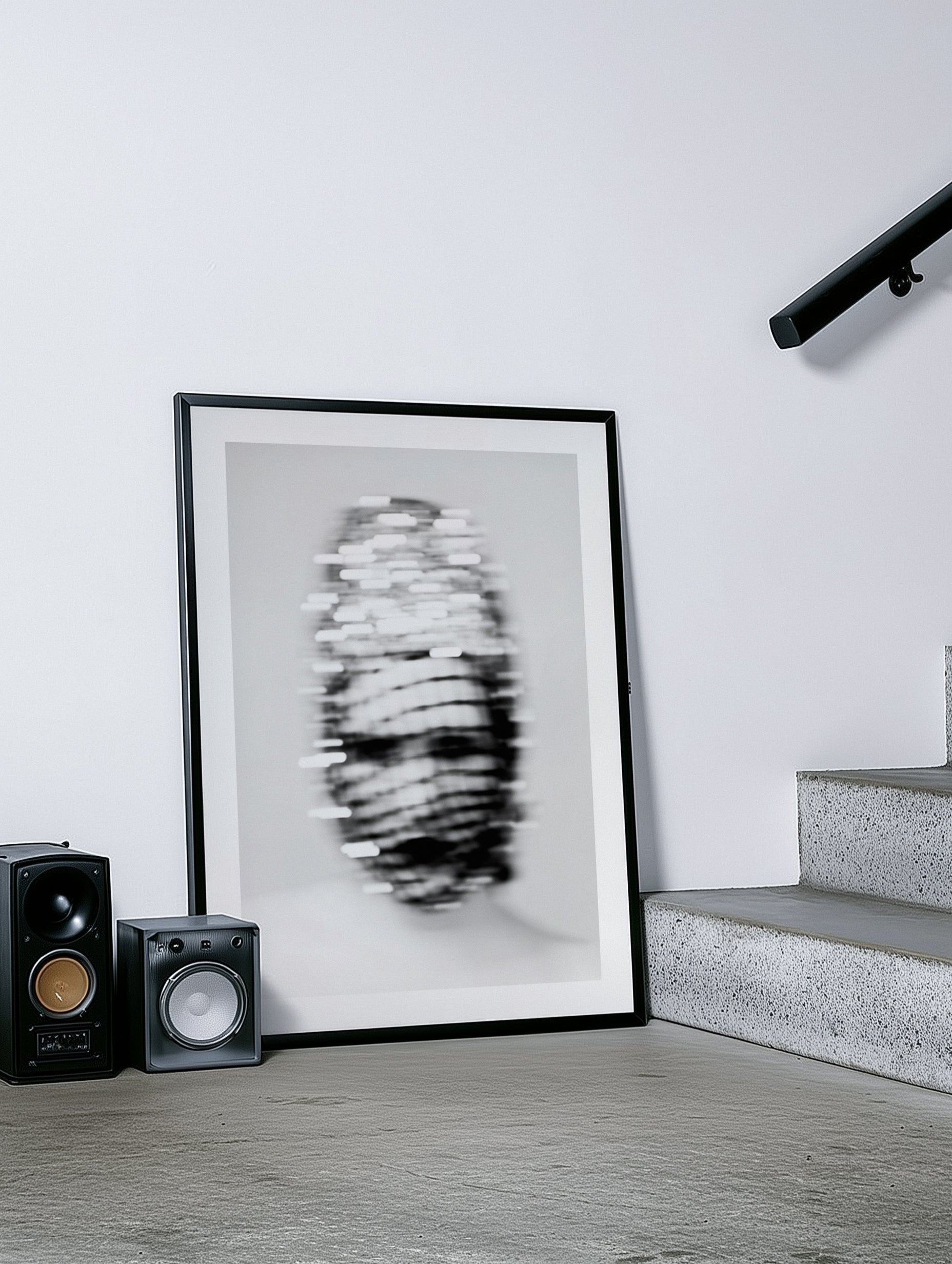 Framed black and white art print on a wall 