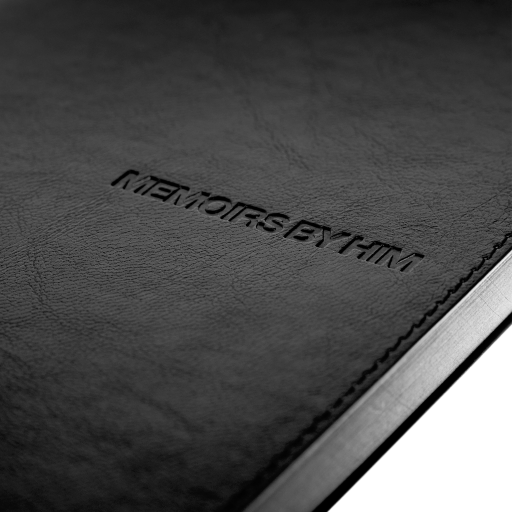 Black leather journal with 'MEMOIRS BY HIM' embossed on the cover