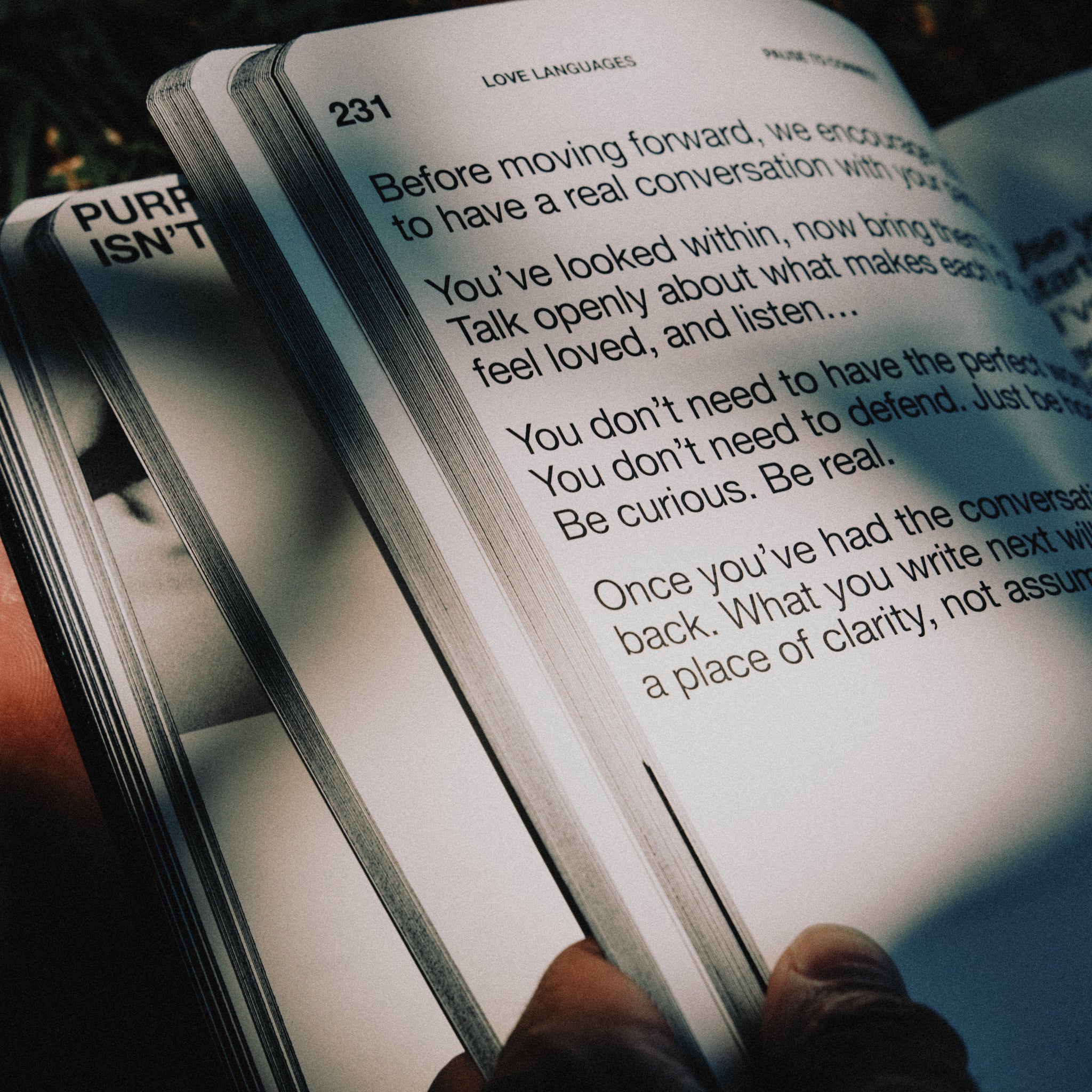 Hand holding an open Journal